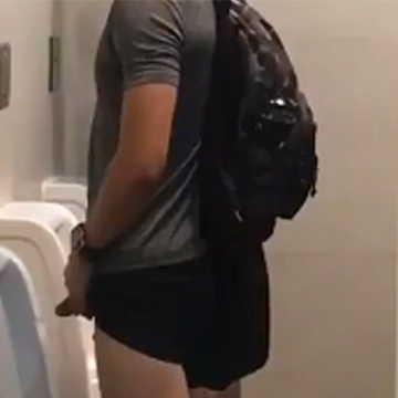 Another sporty dude caught peeing at the urinals | Daily Dudes @ Dude Dump