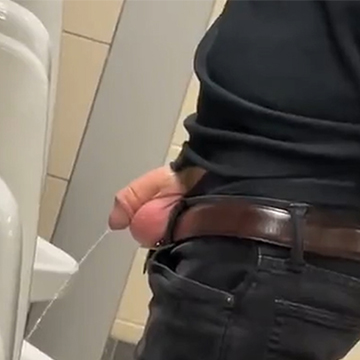 Guy peeing at urinals with cock and balls out | Daily Dudes @ Dude Dump